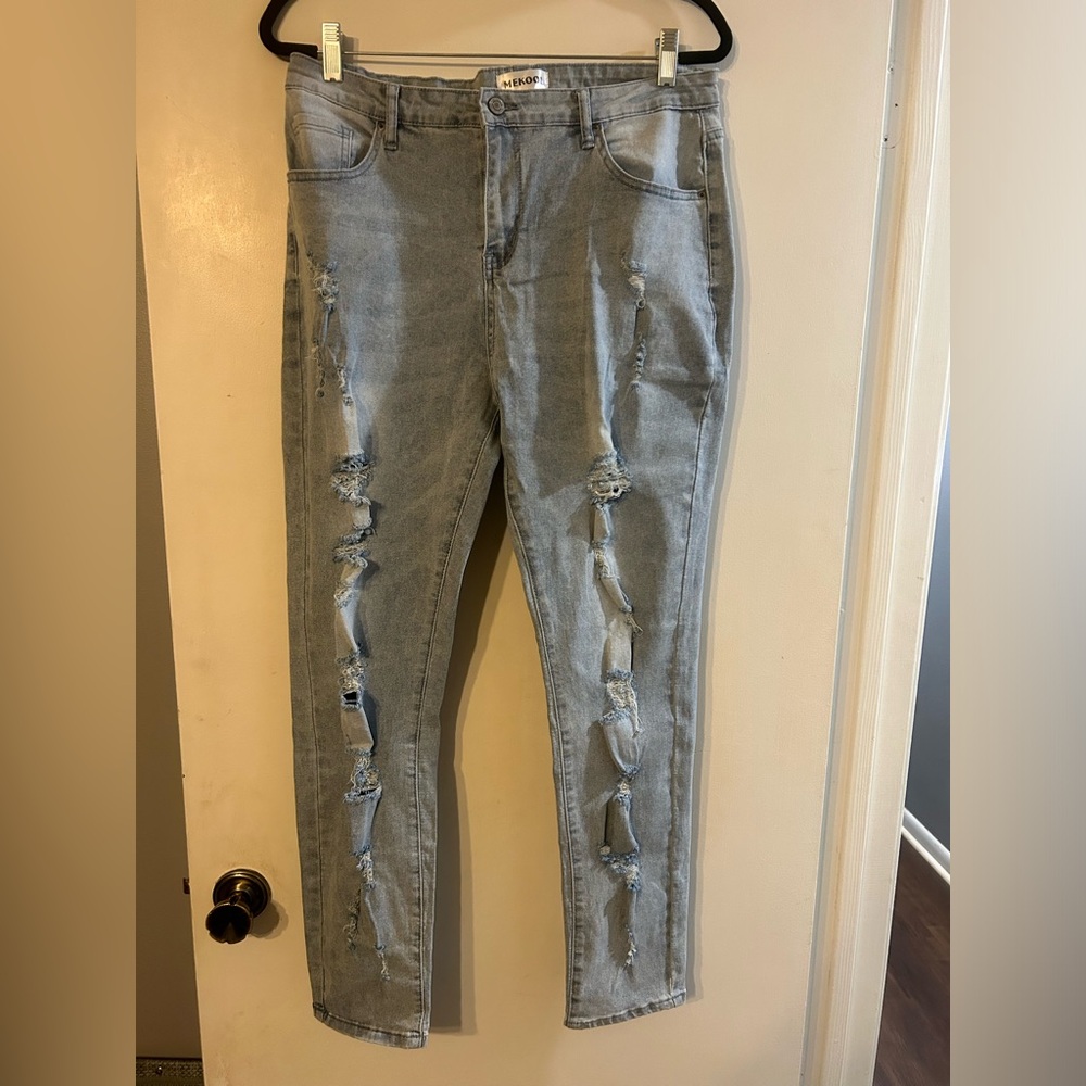 NWT. Mekool brand stretchy jeans. Light wash. Distressed style.